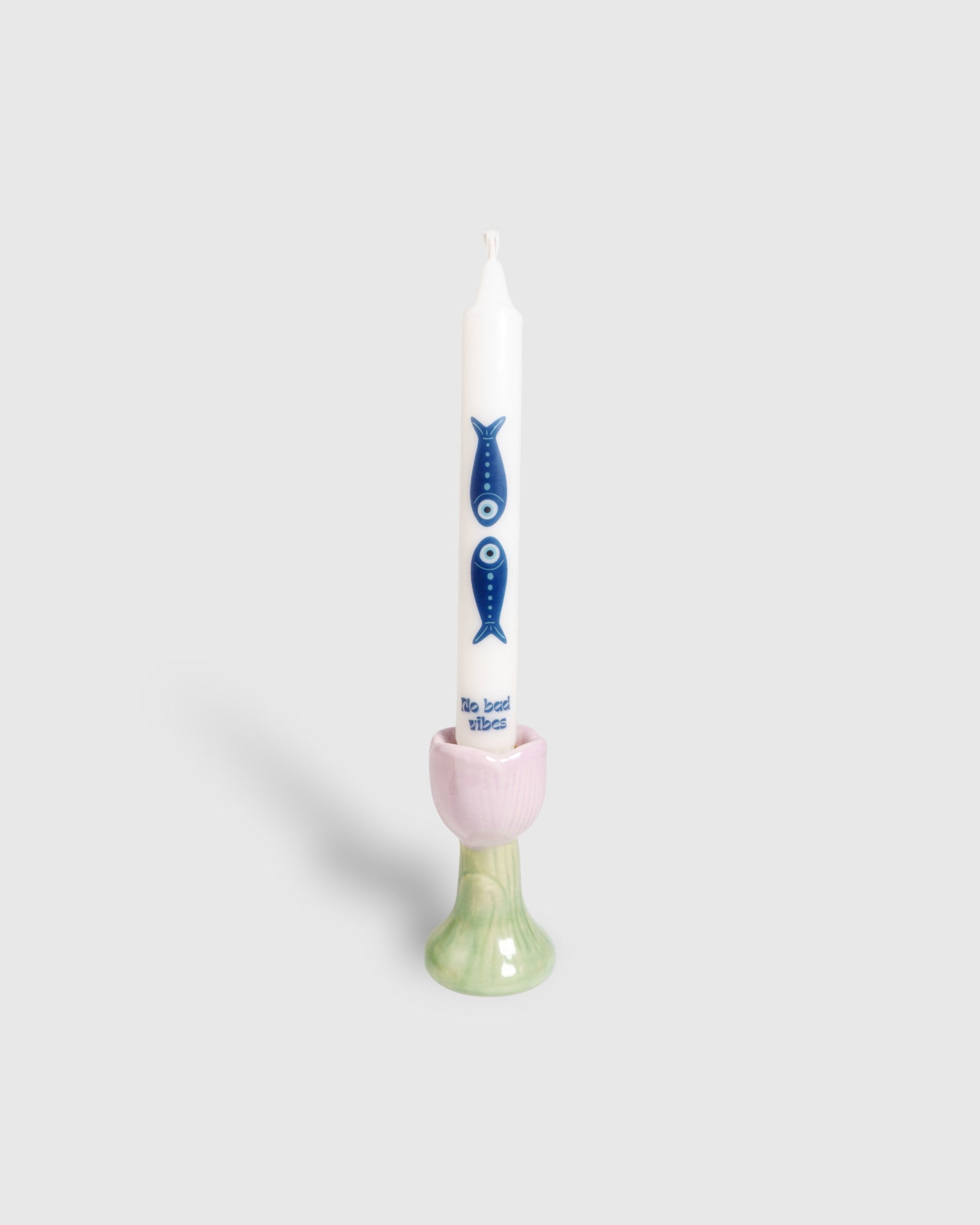 White taper candle with Nazar fish motifs 