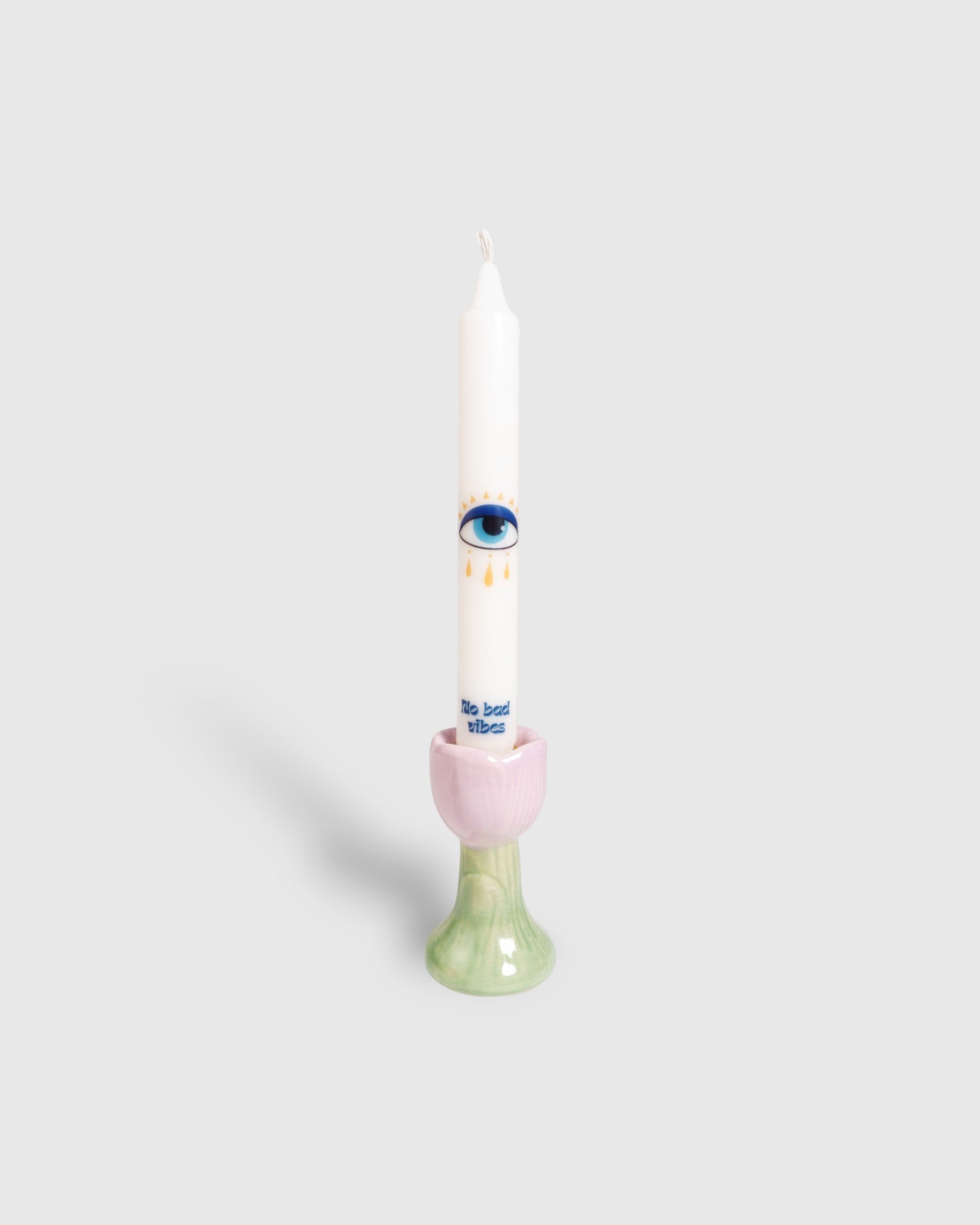 White vegan stearin taper candle with evil eye motifs 