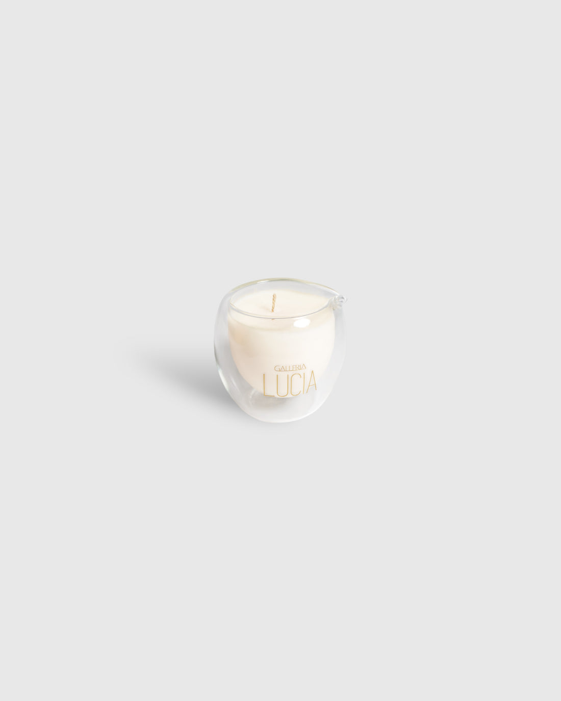 Luxury massage candle with a gold label in a white background