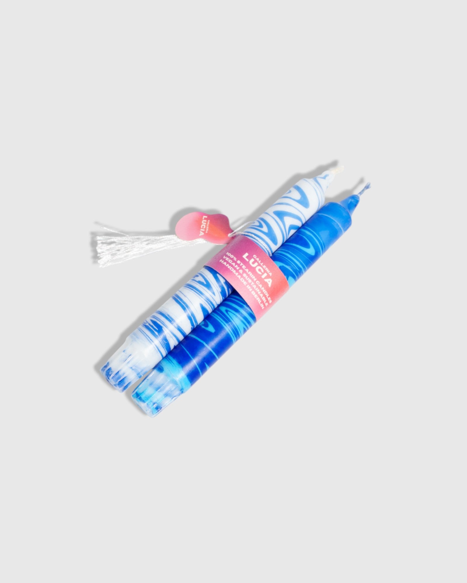 Blue marble candle set of two in a pink packaging